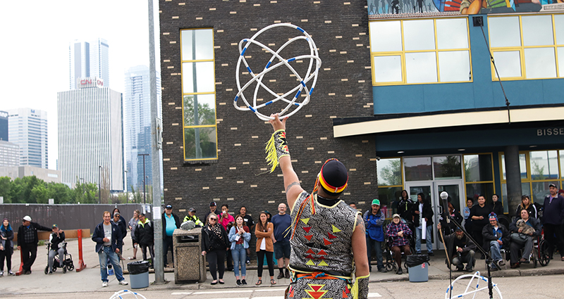 Photo of man holding hoops at National Indigenous Peoples Day