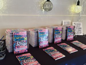 Several copies of the Born Broken book displayed at the book launch.