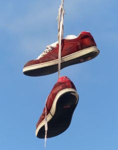 Red shoes hanging with a blue sky background