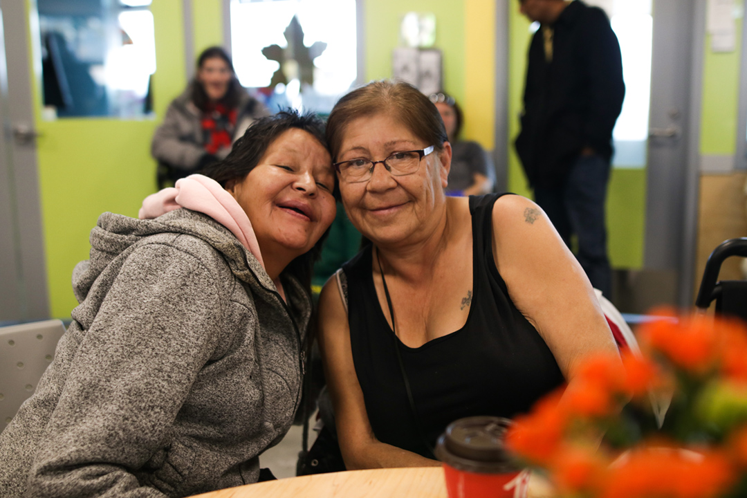 Two women smiling in Bissell Community Space