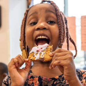 Child eating a Smile Cookie